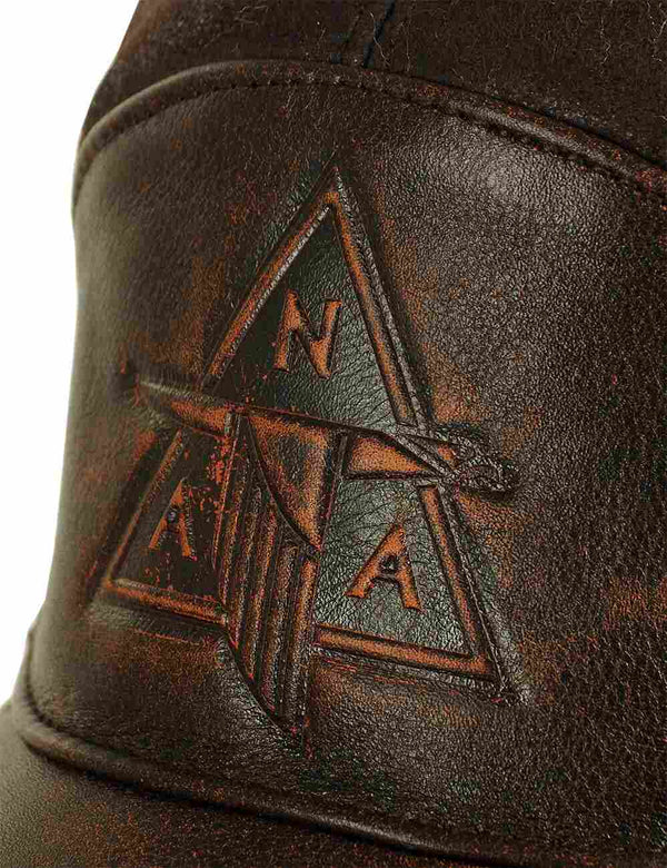 Embossing on a brown men's cap with fur.