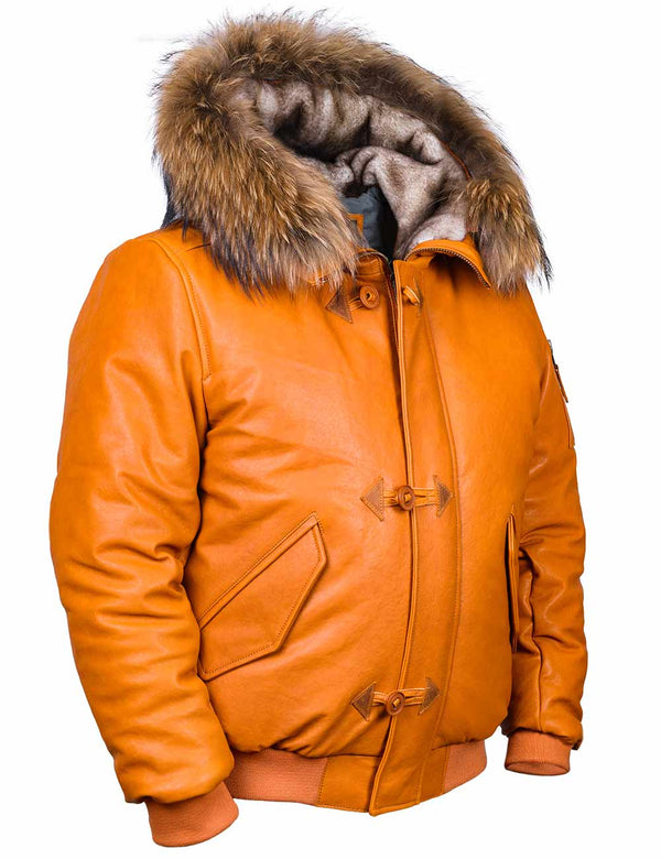 Short men's orange leather jacket with a sheepskin-lined hood and raccoon fur trim, slightly side view.