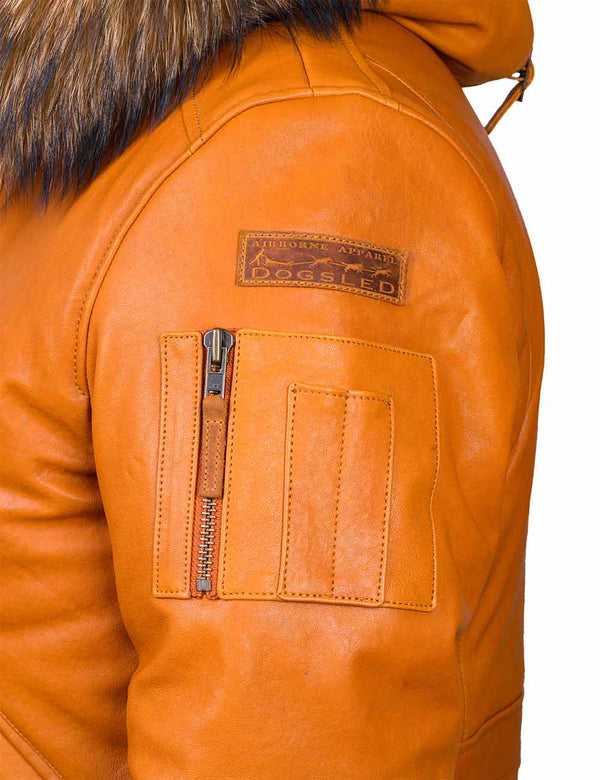 Utility pocket and a patch on the left sleeve of men's orange leather hooded jacket.