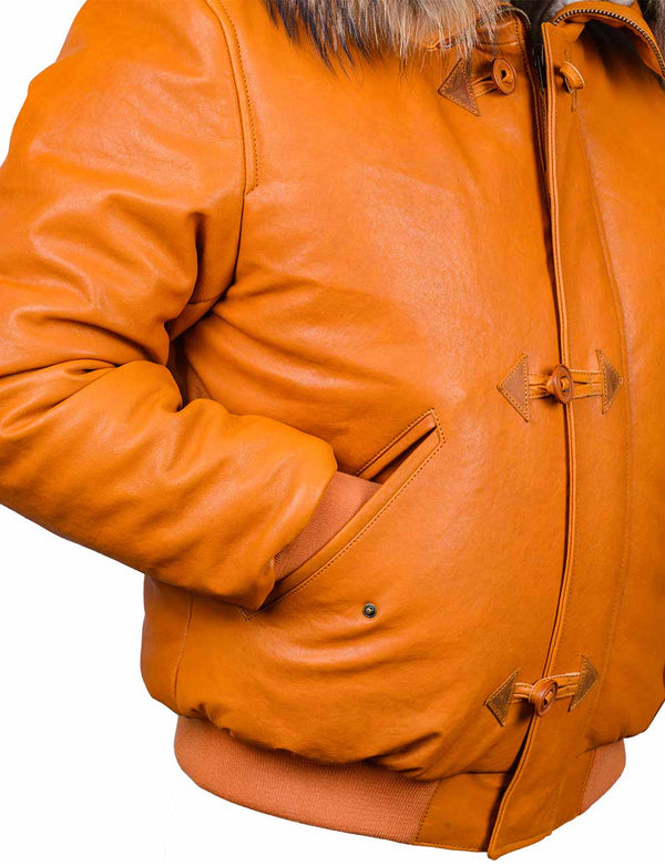 Right side of a short men's orange leather jacket with a sleeve in the pocket.