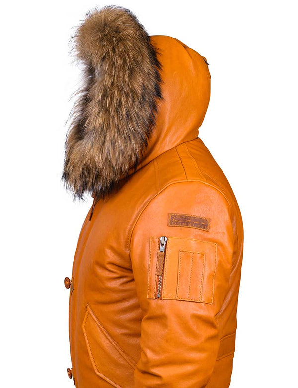 Short men's orange leather jacket with raccoon fur trimmed hood, side view.