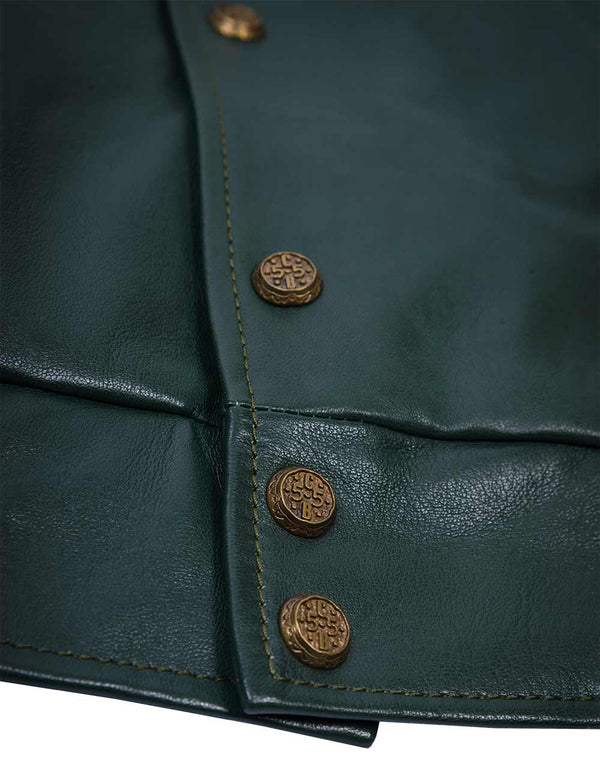 Golden lower metal buttons of a men's dark green leather jacket.