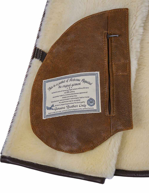 Inside pocket with a patch of the men's light brown sheepskin vest.