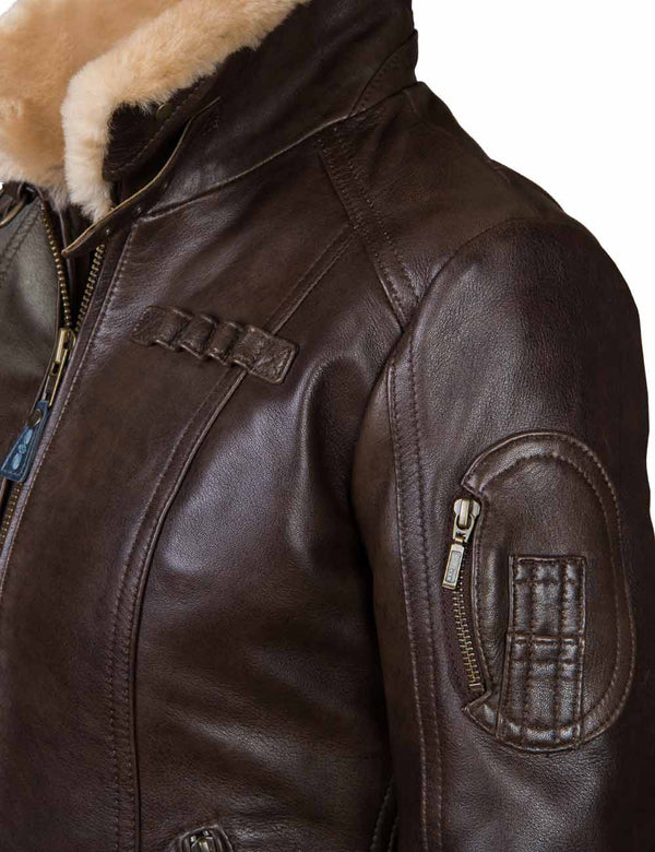 The left upper part of a women's brown leather jacket.